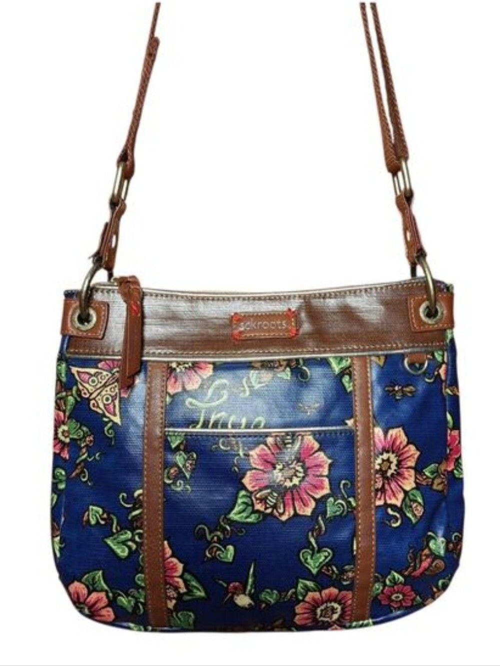 Sakroots artist circle crossbody bag navy blue floral print and brown straps.